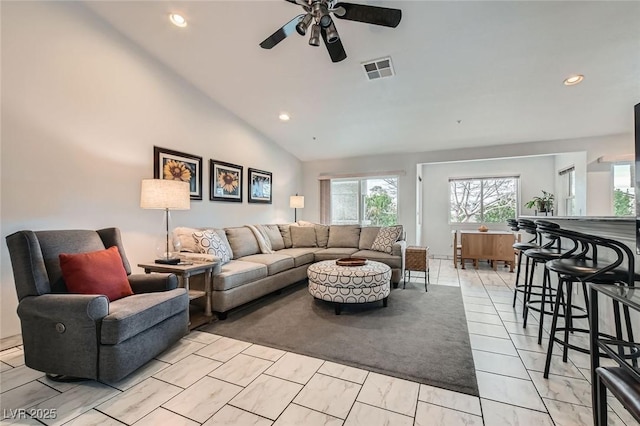 living room with lofted ceiling, a ceiling fan, visible vents, and recessed lighting