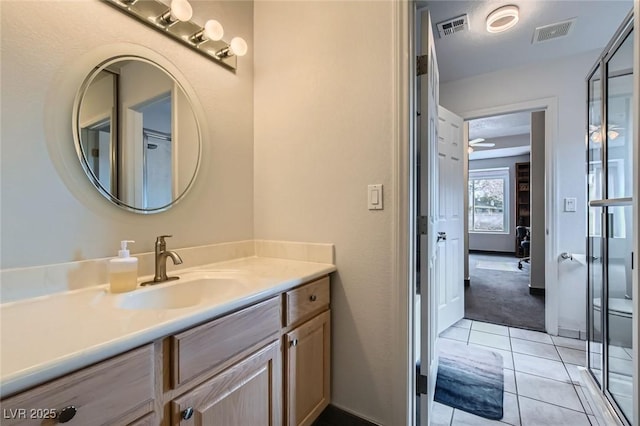 bathroom featuring vanity, visible vents, and tile patterned floors