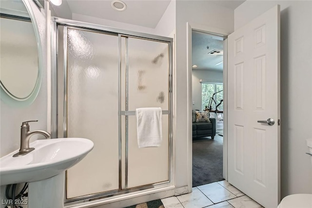 bathroom featuring a stall shower, visible vents, toilet, ensuite bathroom, and marble finish floor