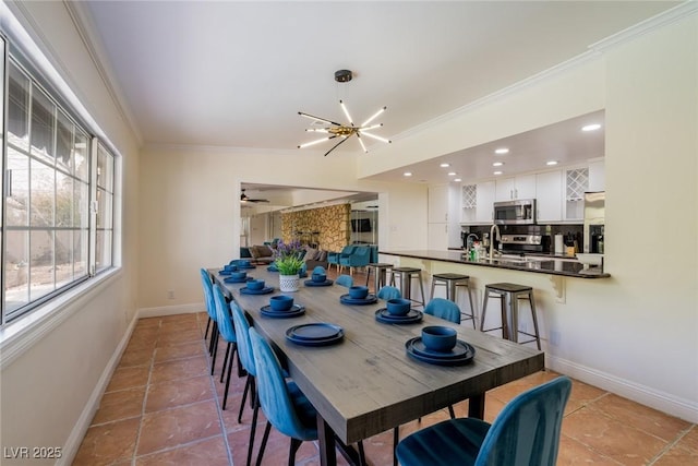 dining space featuring light tile patterned floors, recessed lighting, ceiling fan with notable chandelier, baseboards, and crown molding