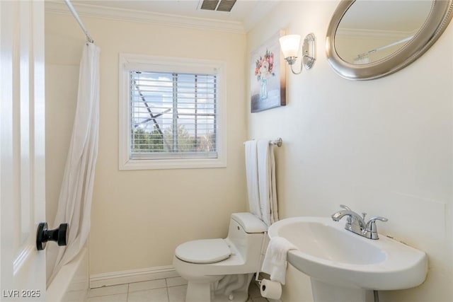 bathroom featuring tile patterned flooring, toilet, a sink, visible vents, and ornamental molding