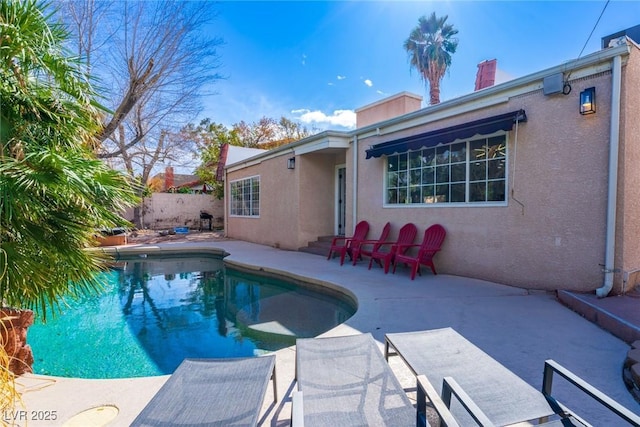 view of pool with fence, a fenced in pool, and a patio