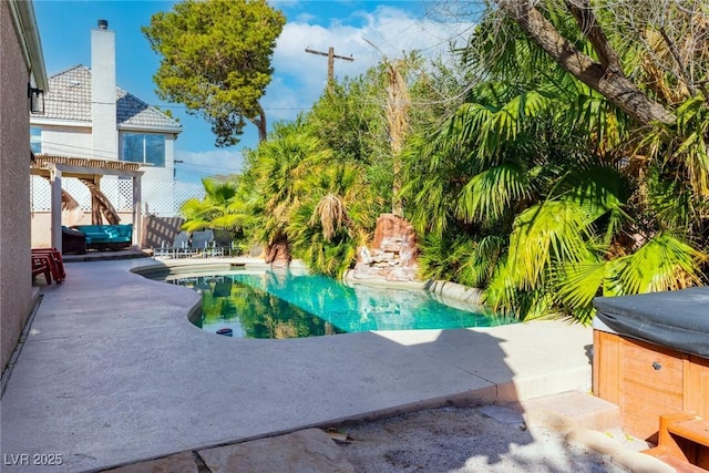 pool with a patio area, fence, a hot tub, and a pergola