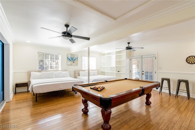 game room featuring ornamental molding, light wood finished floors, and a ceiling fan