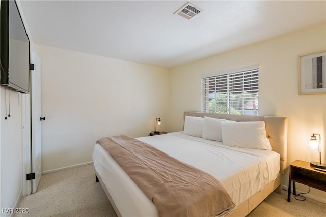 bedroom with baseboards and visible vents