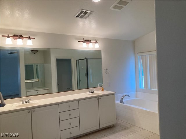 full bathroom with visible vents, a shower stall, and a sink