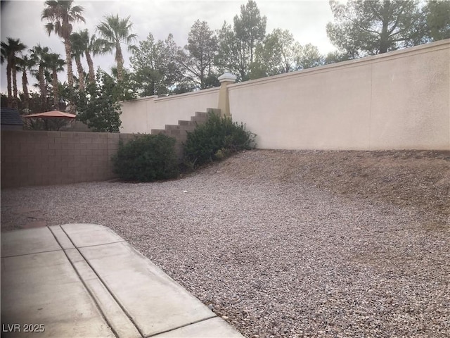 view of yard with a patio area and fence