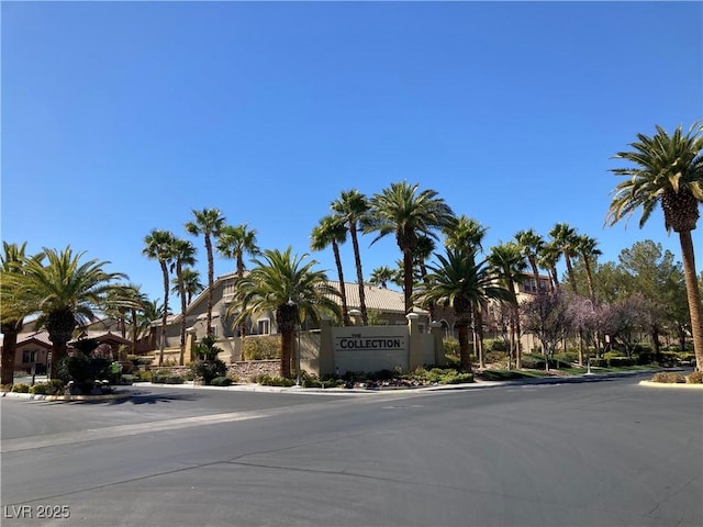 view of road featuring a residential view and curbs