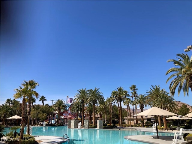 community pool with a patio area