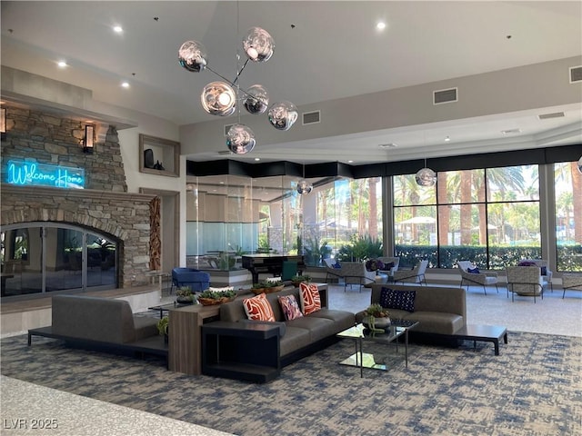 living room with recessed lighting, visible vents, carpet floors, and a fireplace