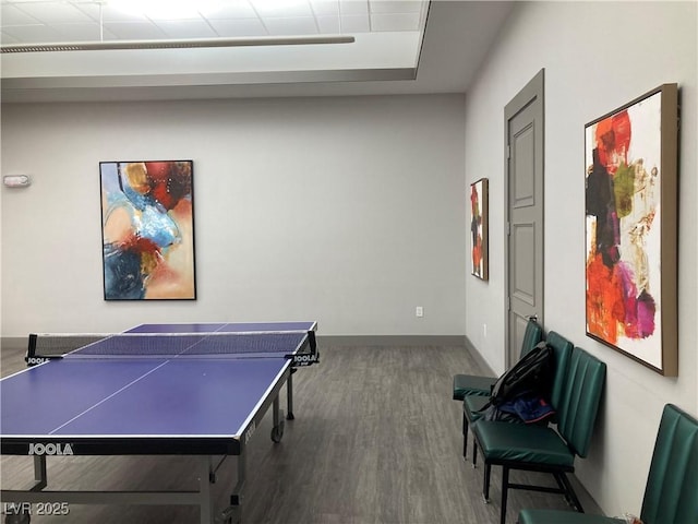 playroom with baseboards and wood finished floors