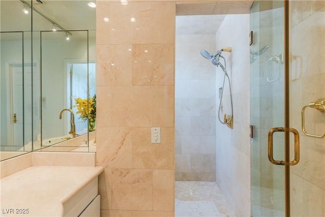 full bathroom featuring a stall shower and vanity