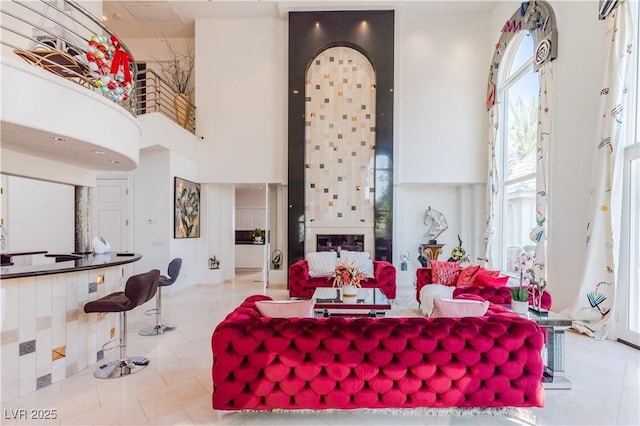 tiled living room with a high ceiling