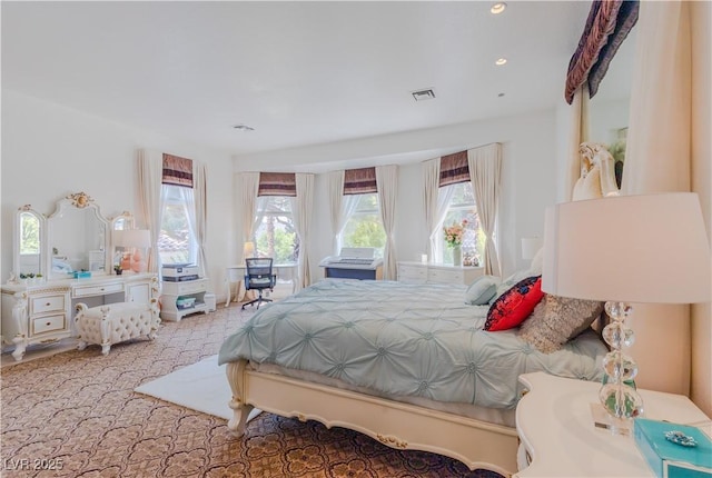 bedroom with recessed lighting and visible vents