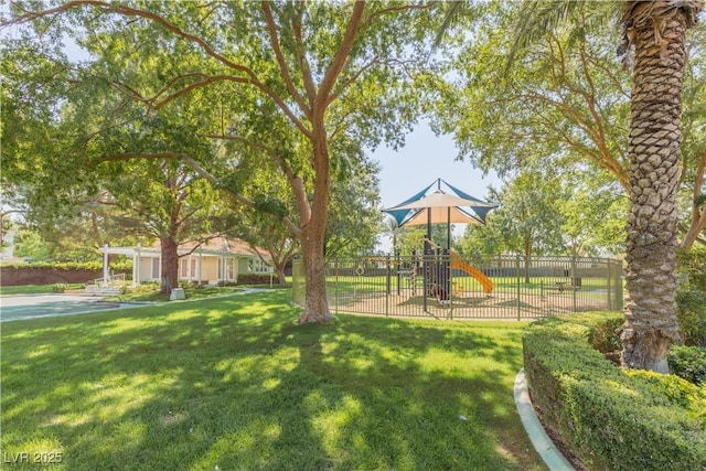 communal playground with fence and a lawn