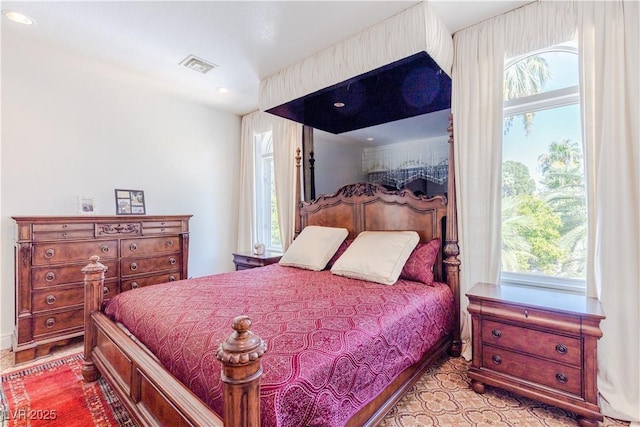 bedroom featuring visible vents