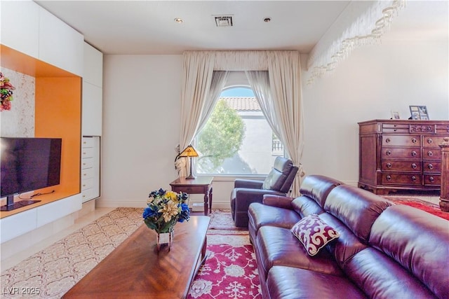 living room featuring visible vents