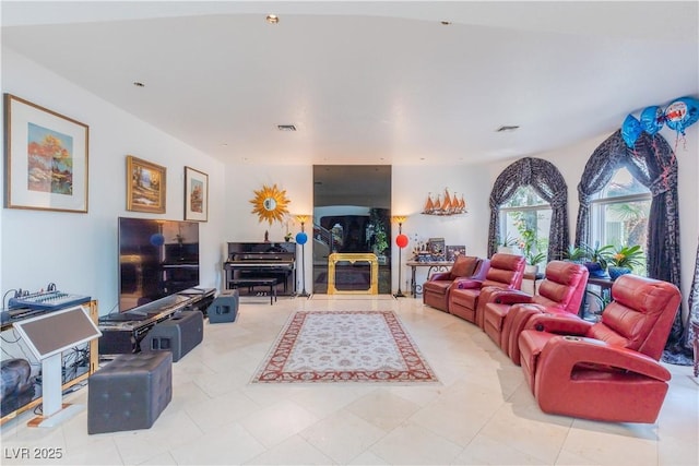 living room featuring visible vents