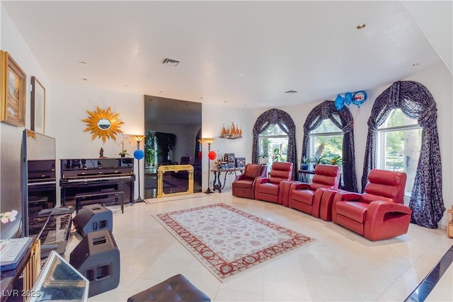 living room featuring tile patterned flooring, visible vents, and recessed lighting