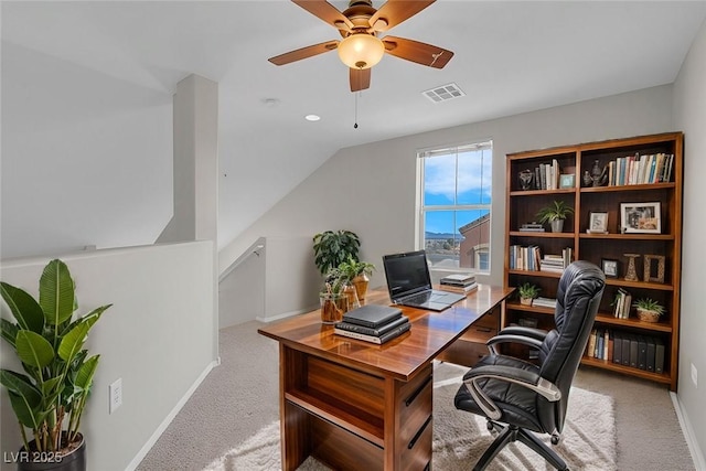 office area with visible vents, baseboards, a ceiling fan, and carpet flooring