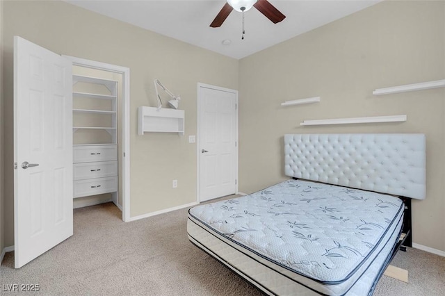 bedroom with a ceiling fan, baseboards, and carpet floors