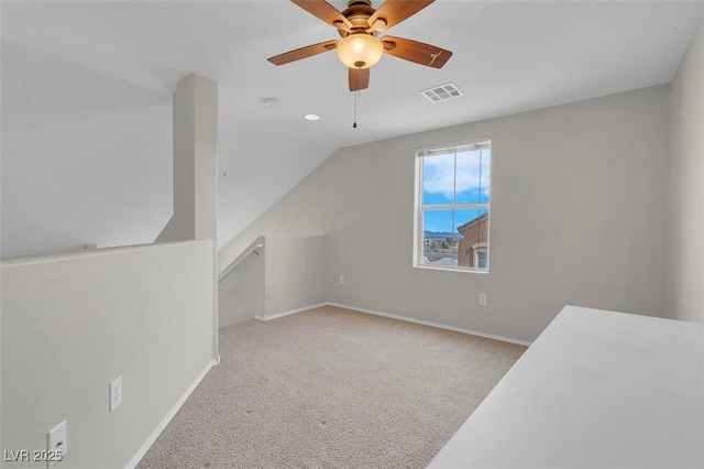 bonus room with visible vents, baseboards, carpet, vaulted ceiling, and a ceiling fan