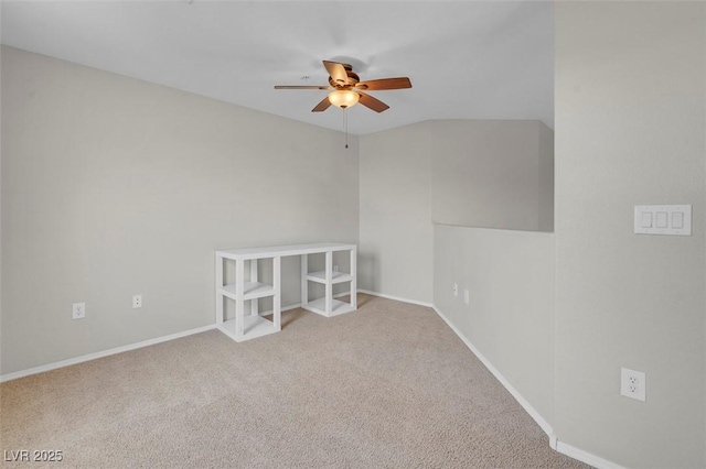 carpeted empty room with baseboards and ceiling fan