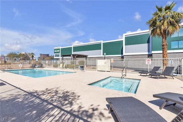 pool featuring a patio area and fence