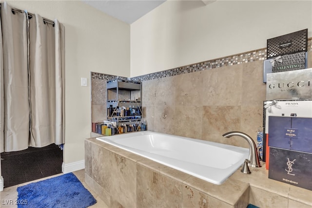 full bathroom with a garden tub and tile patterned flooring