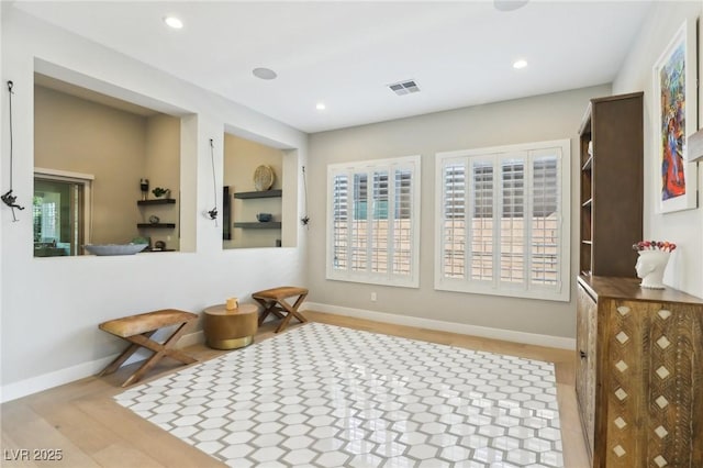 interior space with baseboards, visible vents, and recessed lighting