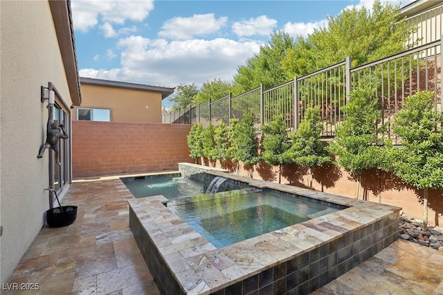 view of pool with a fenced backyard, a patio, and an in ground hot tub