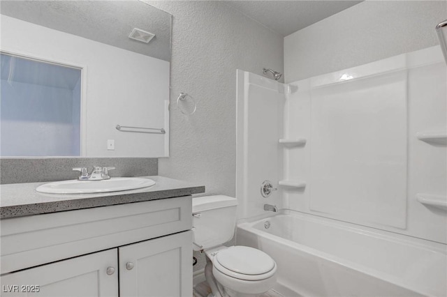 bathroom with visible vents, a textured wall, toilet, a textured ceiling, and vanity