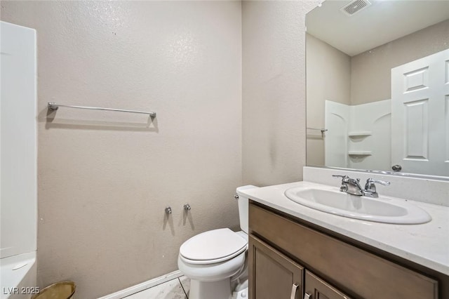 bathroom featuring visible vents, vanity, and toilet