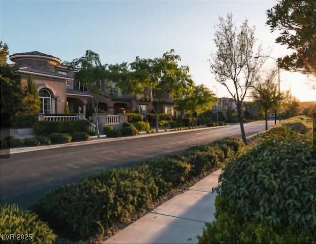 view of street featuring curbs and sidewalks