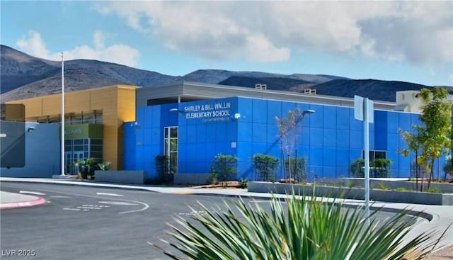 view of building exterior featuring a mountain view