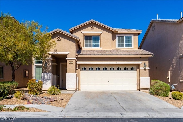 view of front of property with a tiled roof, a garage, driveway, and stucco siding