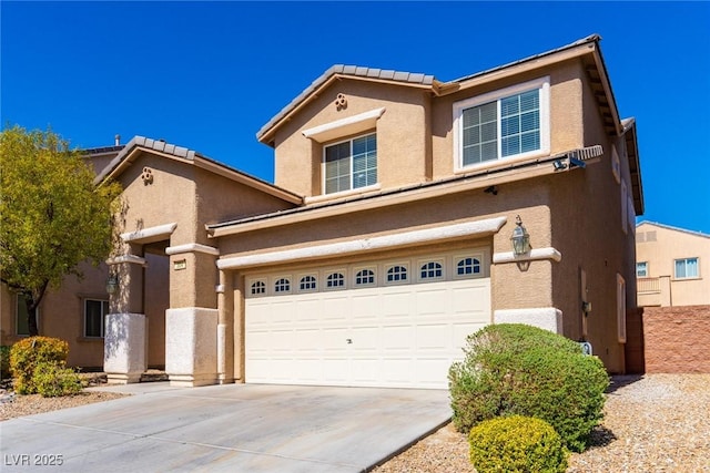 view of front of house featuring stucco siding, an attached garage, and driveway