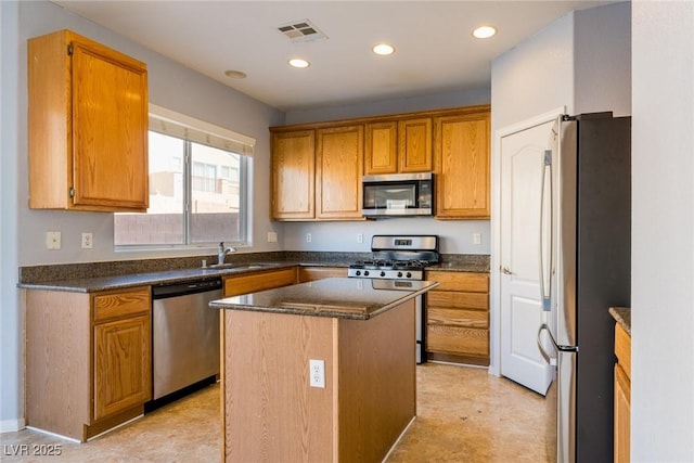 kitchen featuring visible vents, recessed lighting, stainless steel appliances, and a sink