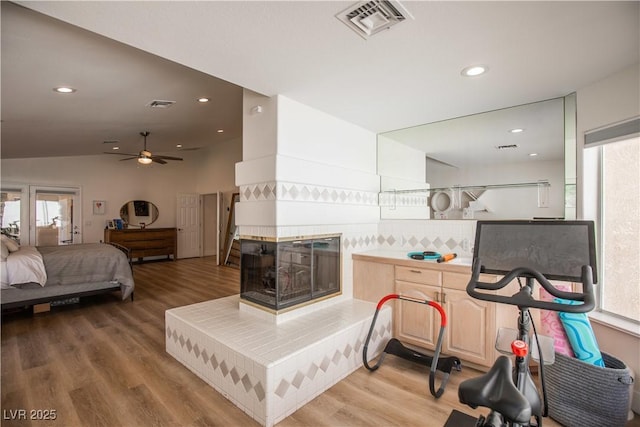 bedroom featuring visible vents, wood finished floors, and recessed lighting