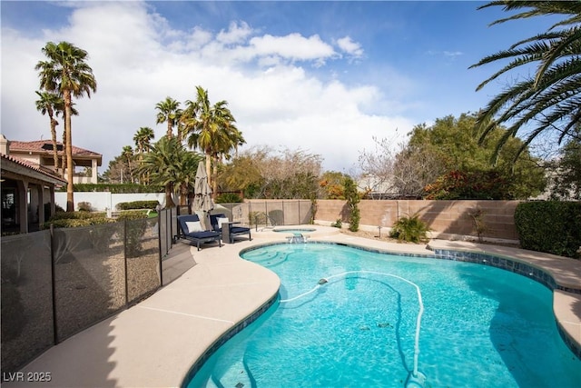 view of swimming pool with an in ground hot tub, a patio, a fenced backyard, and a fenced in pool