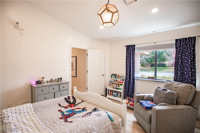 bedroom featuring wood finished floors and recessed lighting