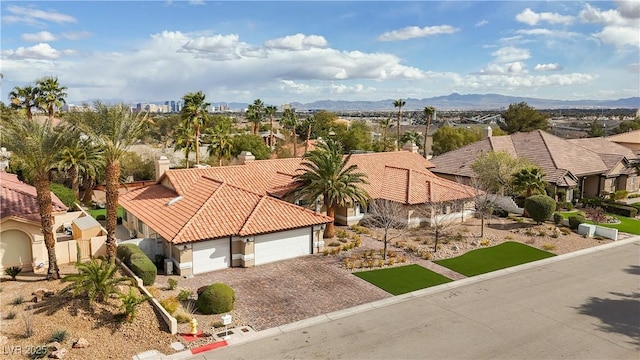 birds eye view of property with a residential view and a mountain view