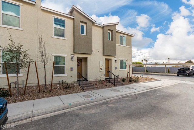 townhome / multi-family property featuring stucco siding