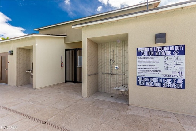 exterior space featuring stucco siding