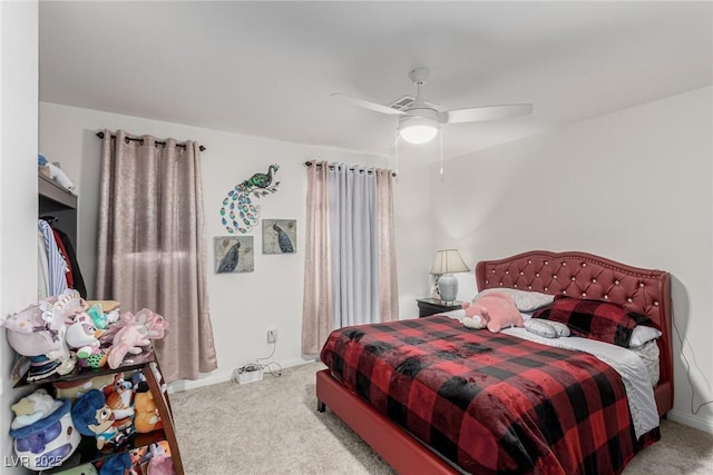 carpeted bedroom with a ceiling fan and baseboards