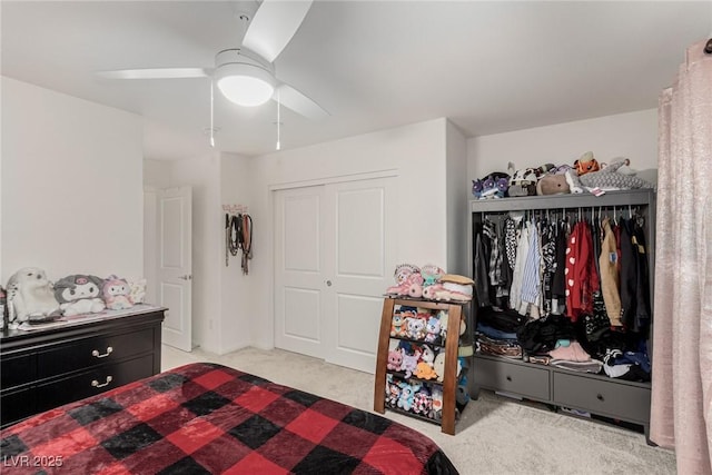 carpeted bedroom with a closet and a ceiling fan