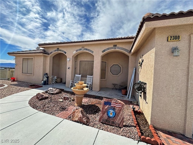 exterior space featuring a patio and stucco siding