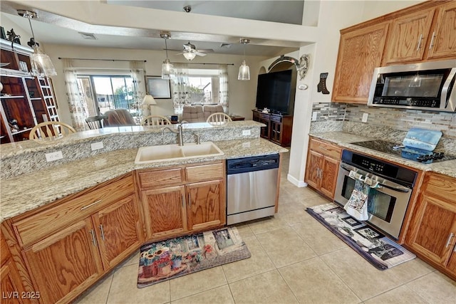 kitchen with light tile patterned floors, visible vents, backsplash, appliances with stainless steel finishes, and a sink