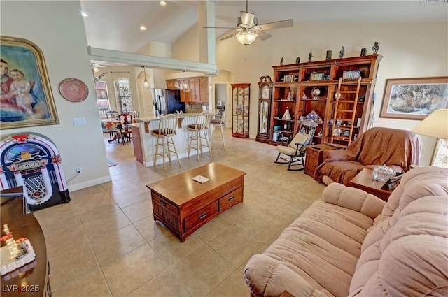 living room featuring high vaulted ceiling, light tile patterned flooring, recessed lighting, a ceiling fan, and baseboards