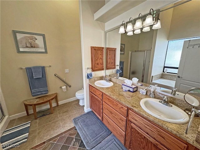 bathroom with a garden tub, tile patterned floors, a sink, and a shower stall